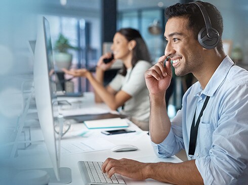 Man talking phone in a call center